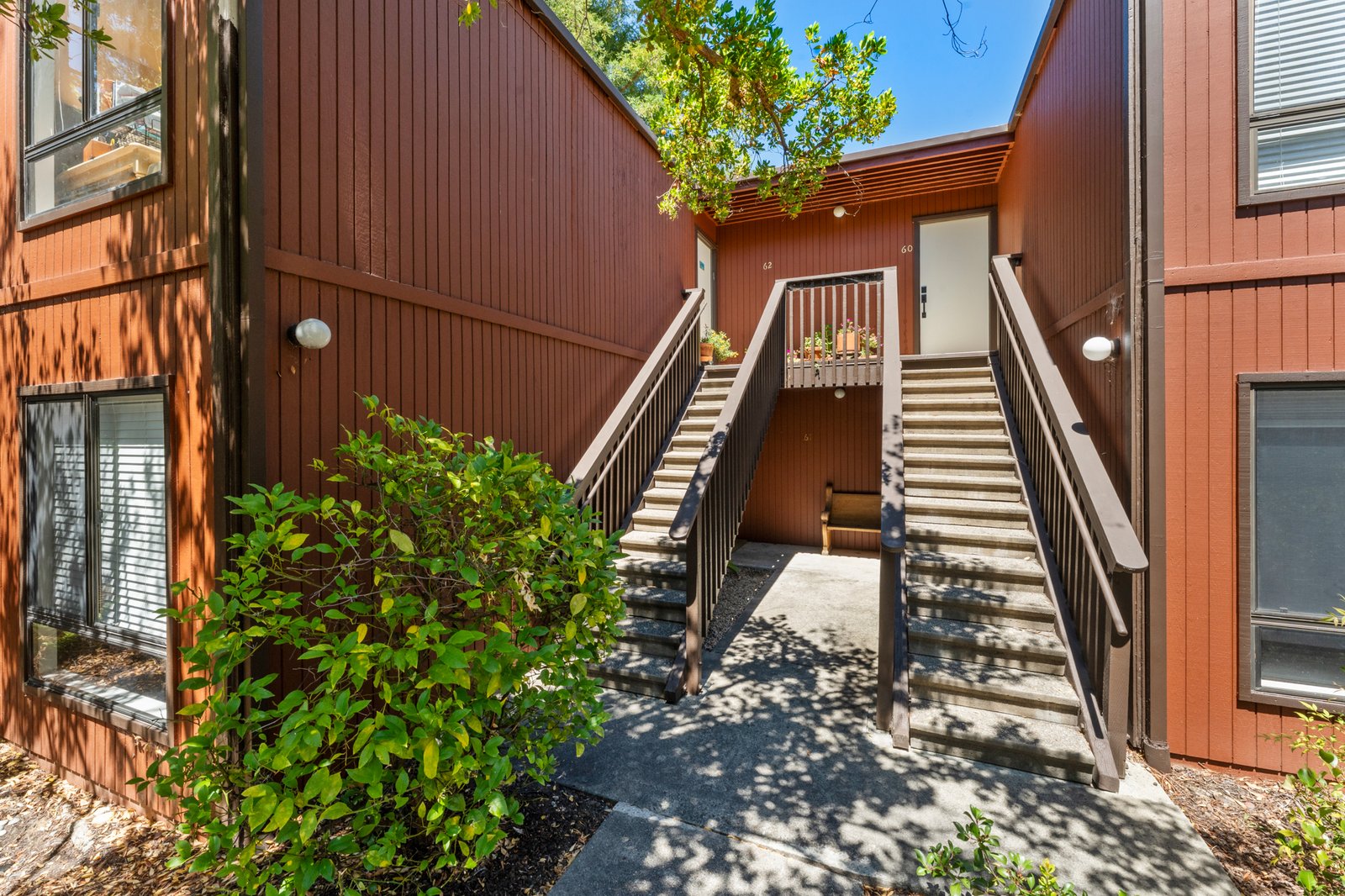 Elegant staircase leading to the residence entry