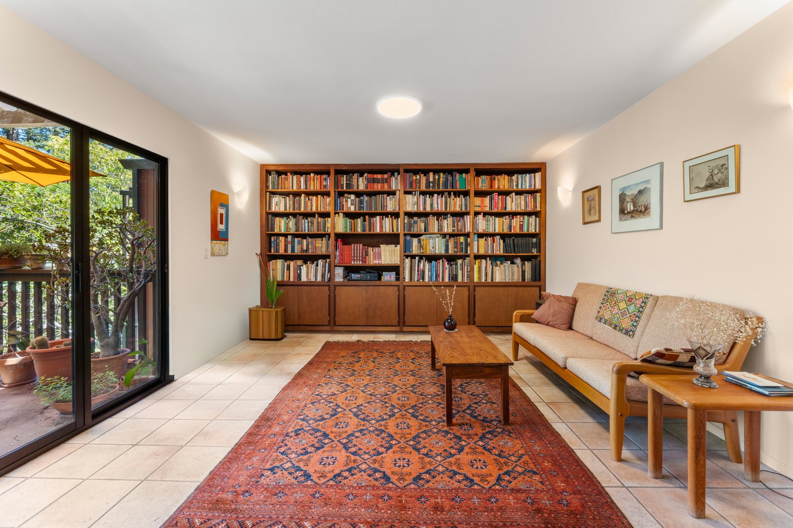 Library-inspired great room with wall-to-wall custom bookshelves