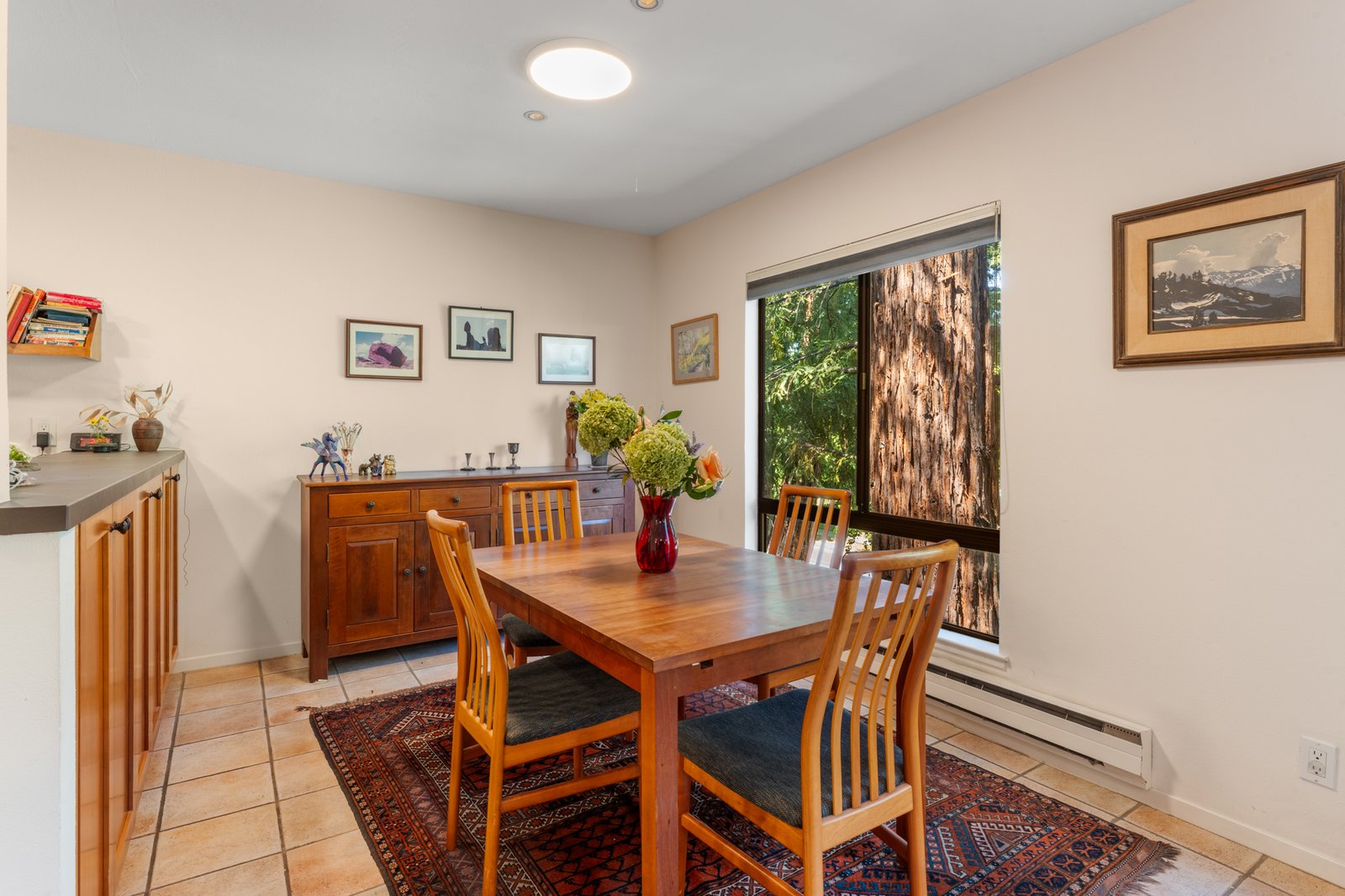 Formal dining area beneath a redwood canopy